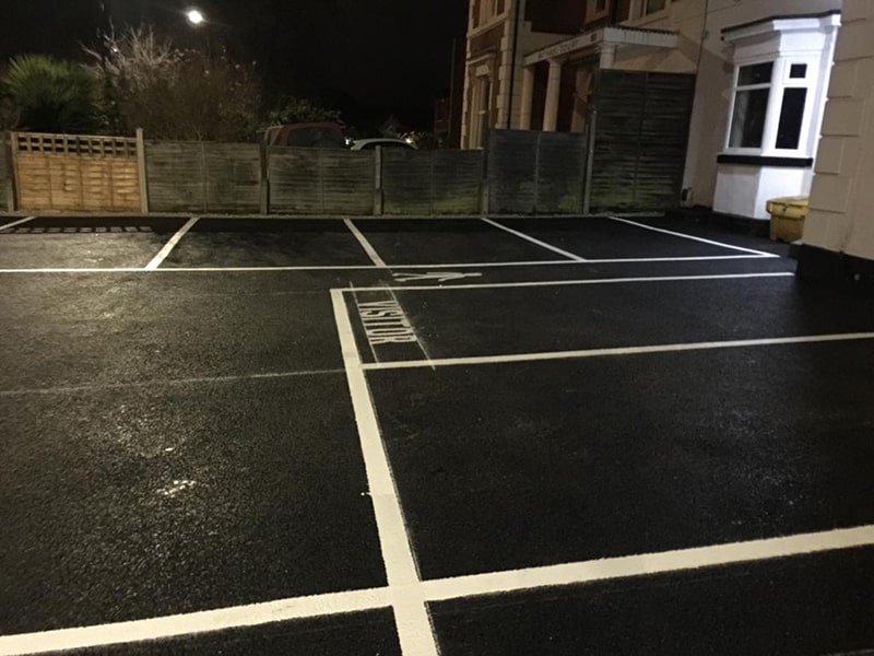 Finished tarmac car park with new bay markings